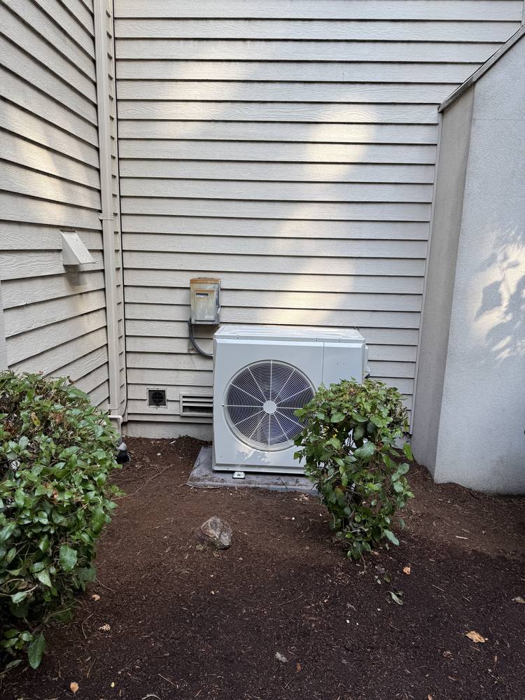 Heat pump outdoor unit installed beside an Issaquah home