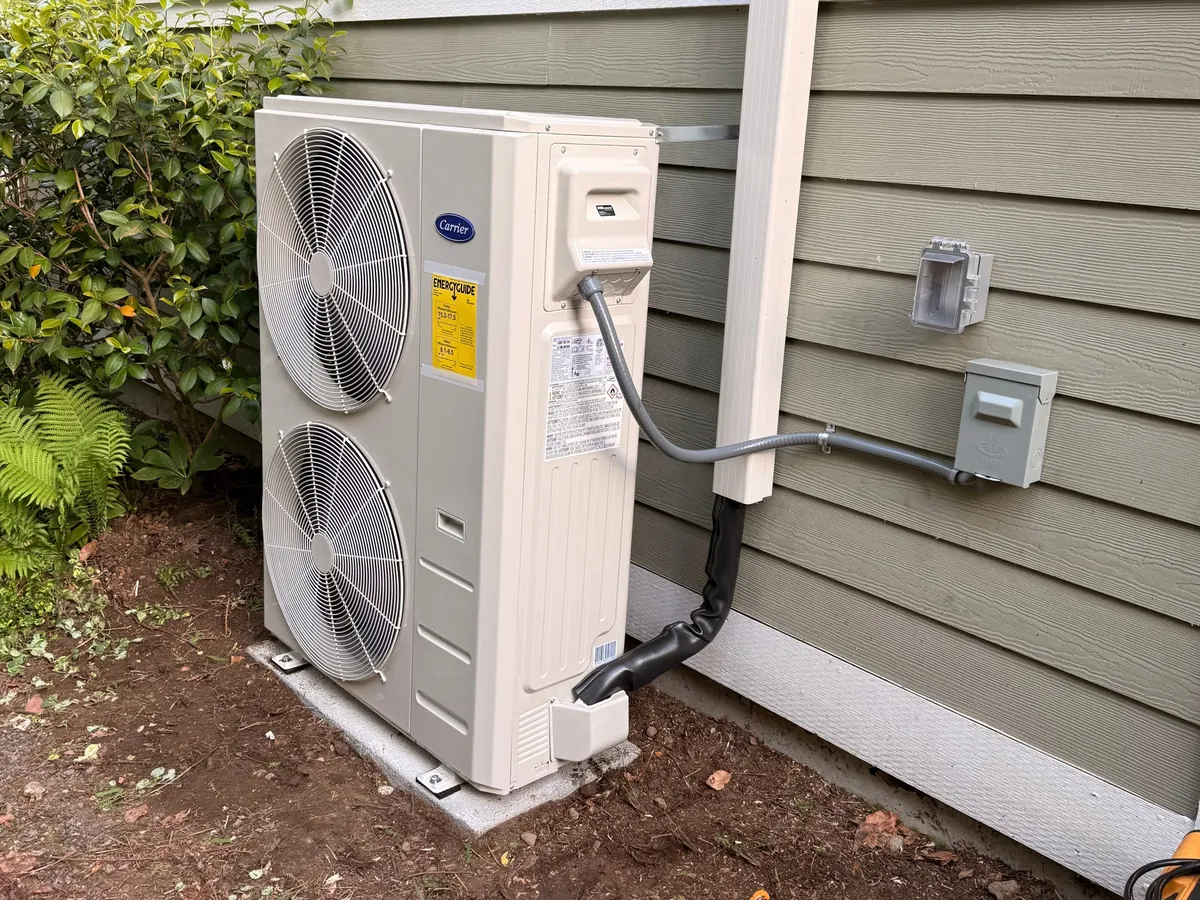 Carrier heat pump outdoor unit with line cover at a Kenmore home
