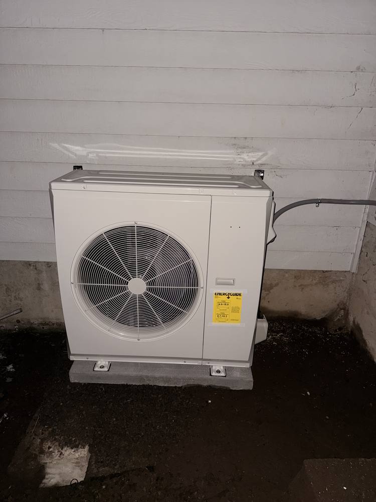 Heat pump outdoor unit installed on a Renton home