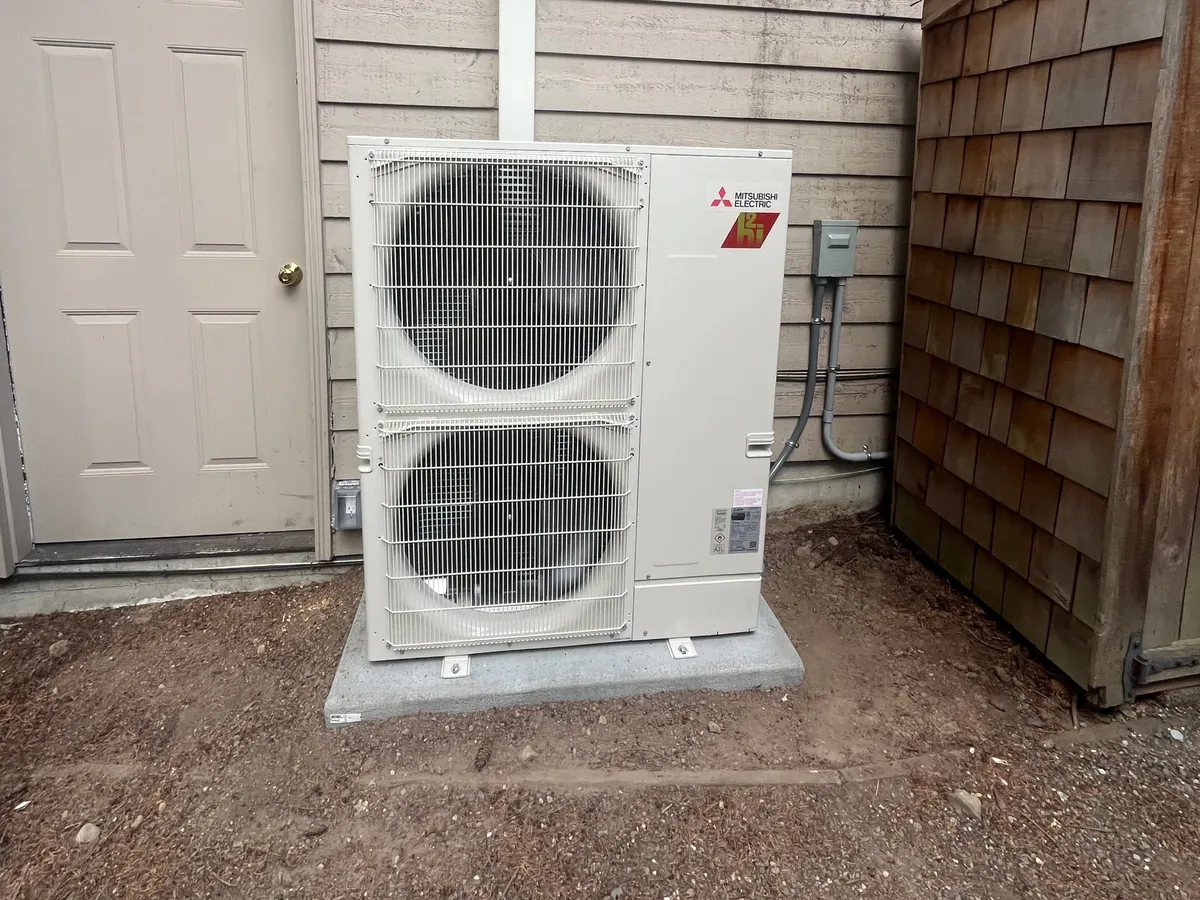 Mitsubishi 4 ton Hyper-Heat outdoor unit on a pad at a Woodinville home