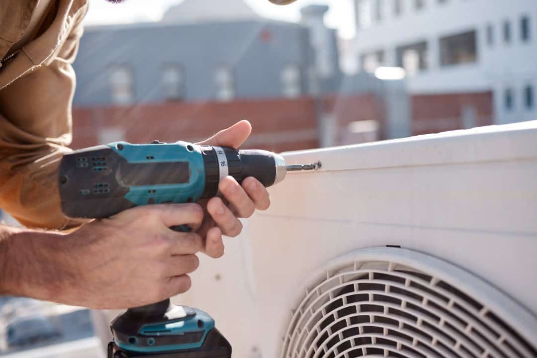An expert HVAC technician handling a quick repair.