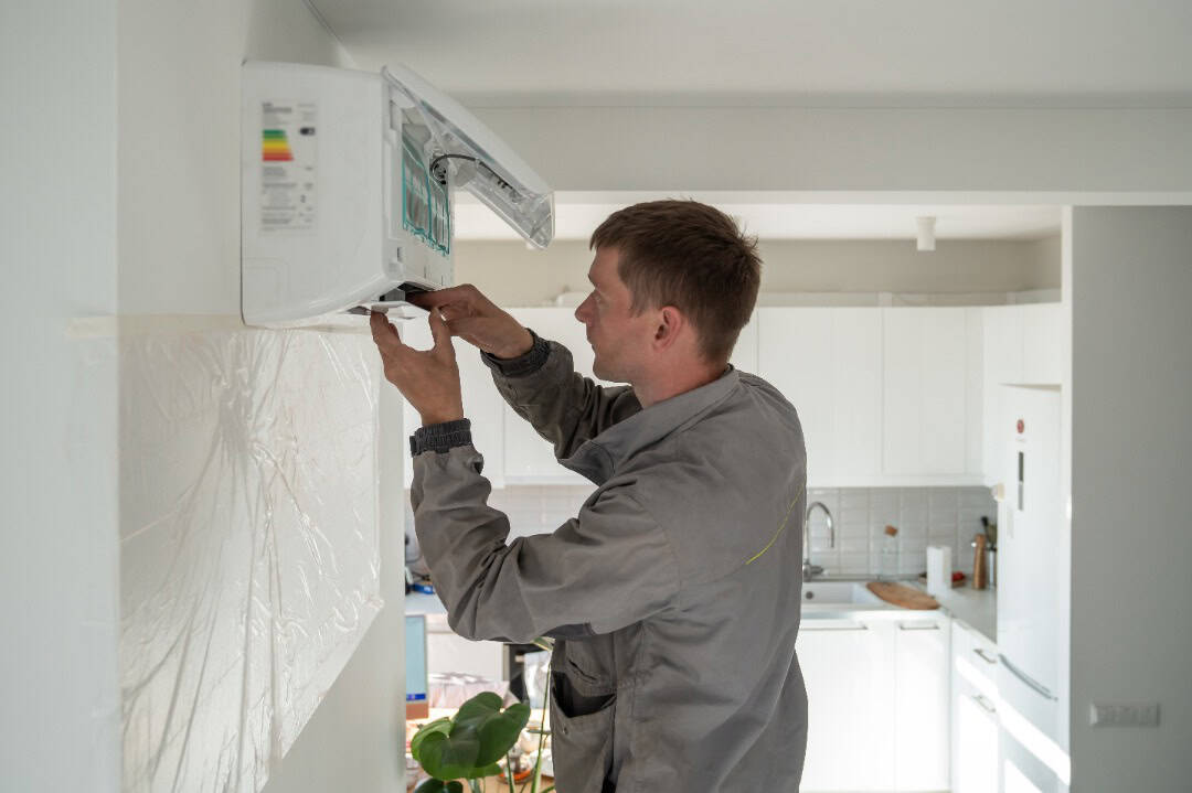 A professional handling a simple AC repair.