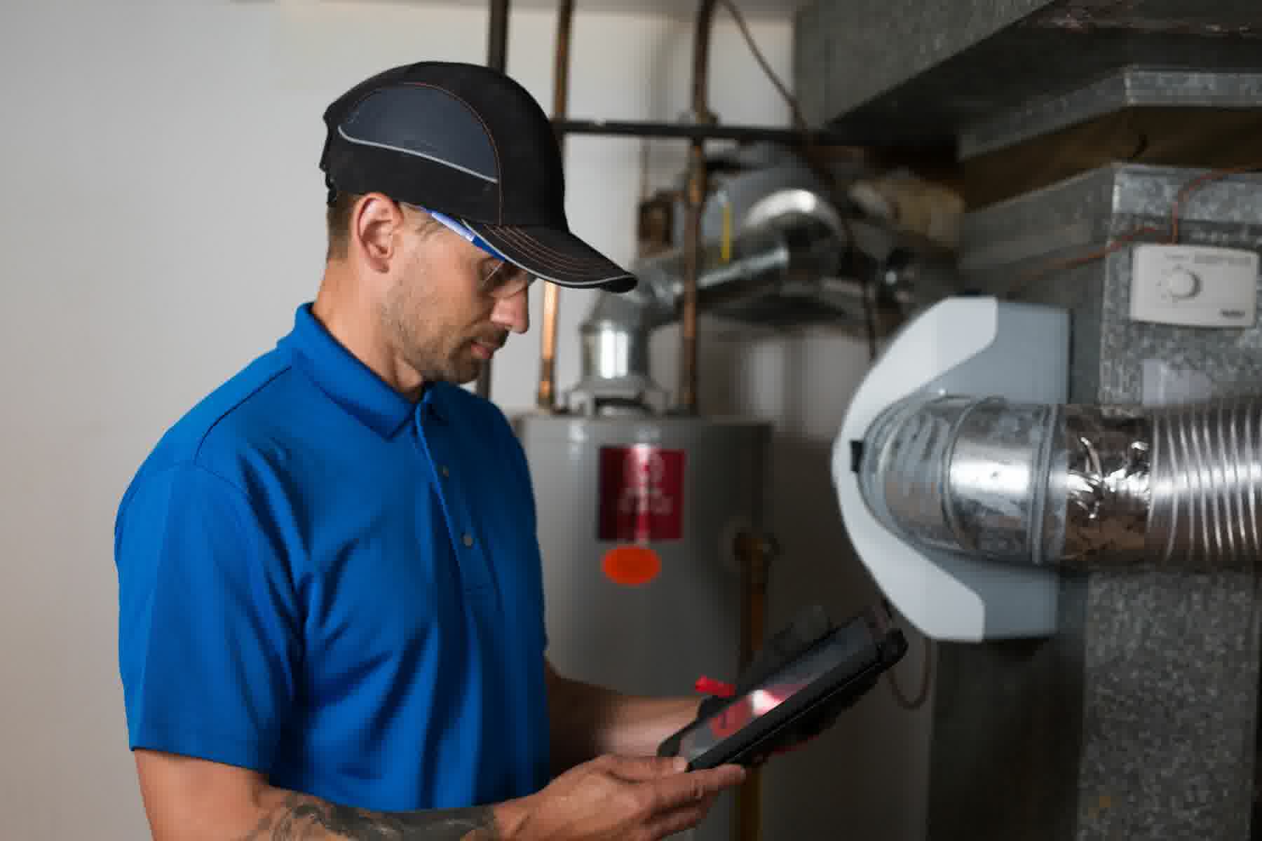 One of our professional HVAC technicians is handling an air conditioning repair job.